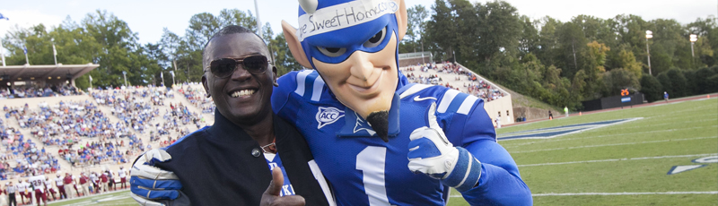 <h3>FIRST BLACK BLUE DEVIL</h3><p>Michael Holyfield, T’79, the first black Blue Devil mascot, returned to campus during homecoming weekend when he was recognized with a letterman’s jacket for his service to Duke.</p><div class="more_button"> <a href="http://today.duke.edu/2013/09/holyfield" target="_blank"> </a> </div>