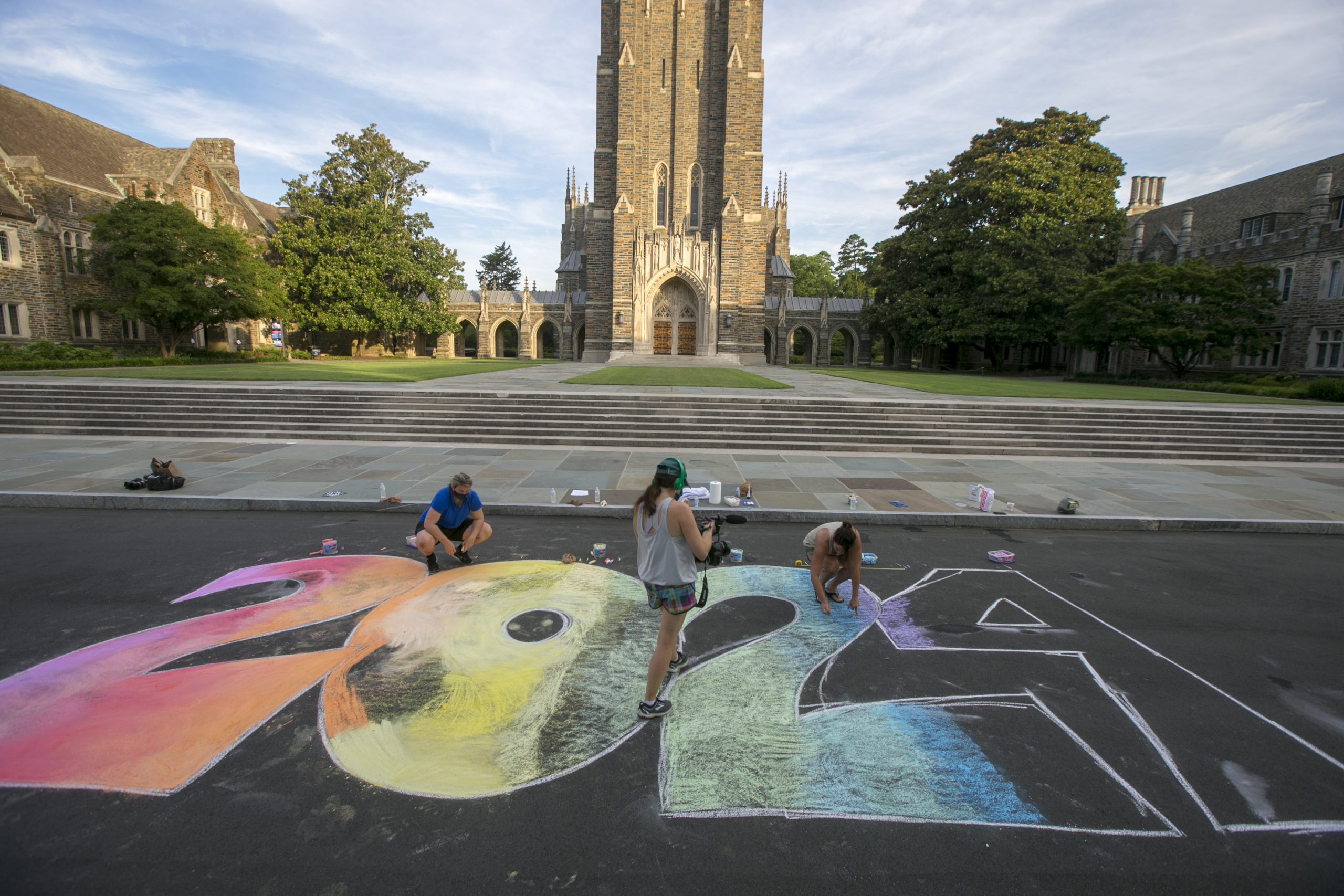 The Duke DISCO team creates a chalk mural to welcome the class of 2024 to campus for the Fall in front of Duke Chapel.
