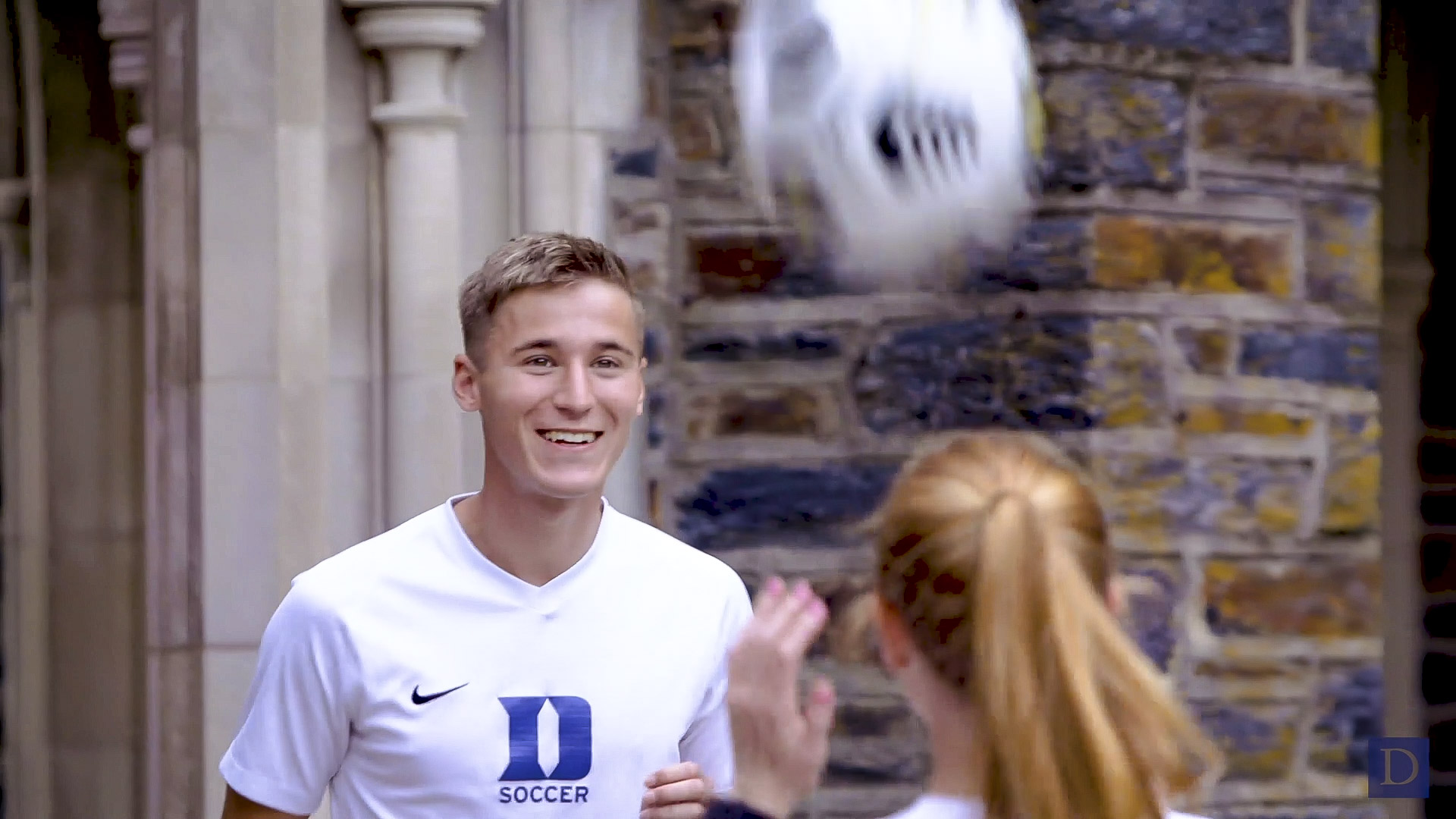 Seniors Daniel Wright and Tess Boade, from the Duke men's and women's soccer team, head each other the ball during our filming session.