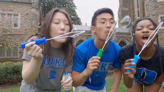Seniors Jiwoo Kim, Martin Trinh, Lenique Huggins and Allayne Thomas blow bubbles as Megan Mendenhall pans the action with a GoPro.